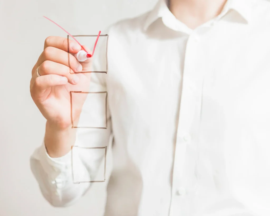 busines -persons hand marking ecom migration checkbox